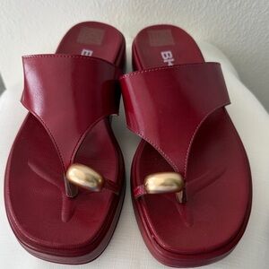 Elegant Red Sandals with Gold Accent